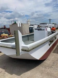 Fitzgerald Metal Works. A small workboat or utility vessel named "Silver Dawn" in Industrial yard outside.