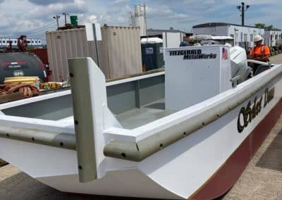 Fitzgerald Metal Works. A small workboat or utility vessel named "Silver Dawn" in Industrial yard outside.