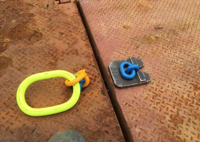 Fitzgerald Metalworks. A close-up of a rusted metal surface, likely part of a deck or platform, with two pieces of equipment on it.