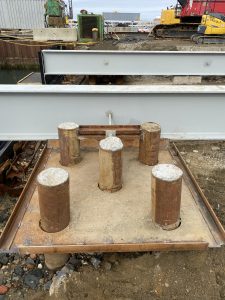 Fitzgerald Metal Works. Iron pegs sticking out between an iron board.