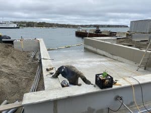 Fitzgerald Metalworks. Marine Construction workers welding with safety equipment on a boat ramp.