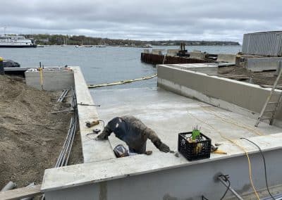 Fitzgerald Metalworks. Marine Construction workers welding with safety equipment on a boat ramp.