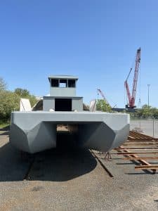 Fitzgerald Metalworks. A large catamaran-style barge vessel under construction