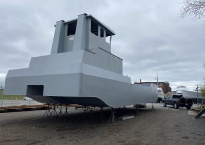 Fitzgerald Metalworks. A large catamaran-style barge vessel under construction