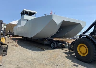 Fitzgerald Metalworks. A large catamaran-style barge vessel under construction