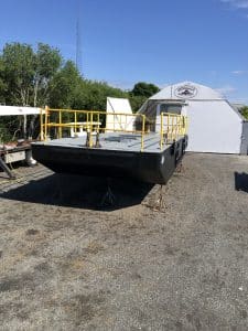 Fitzgerald Metalworks. A large industrial barge on stands outside