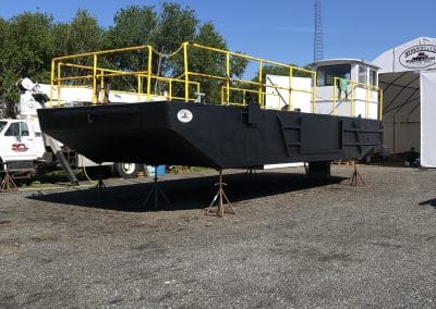 Fitzgerald Metalworks. A large industrial barge on stands outside