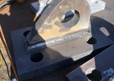 Fitzgerald Metal Works. A close-up of a metal fabrication piece, likely a part of a marine or industrial construction project.