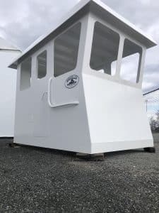 A Fitzgerald Metal Works white boat cabin