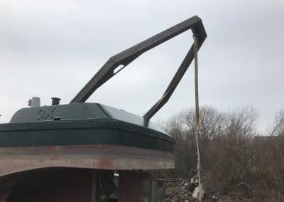 Fitzgerald Metal Works. Stern of a green and brown boat