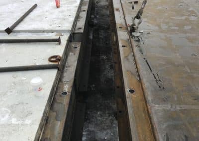 Fitzgerald Metal Works. marine construction site during winter in between two large parallel metal beams