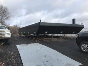 Fitzgerald Metal Works. Newly constructed black barge on stands