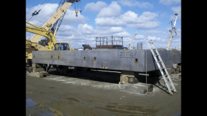 Fitzgerald Metal Works. Barge being worked on outside