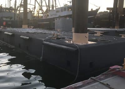 Fitzgerald Metal Works. dock at marina at sunset or sunrise with fishing boats